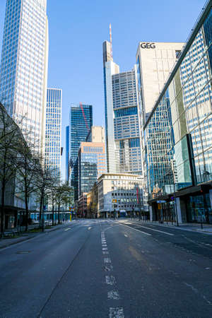 Coronavirus lockdown. Frankfurt, Germany. April 5, 2020. Bankenviertel financial banking district skyscrapers and deserted street during covid19 pandemic.のeditorial素材