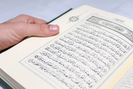 Young man reading the Holy Koranの写真素材