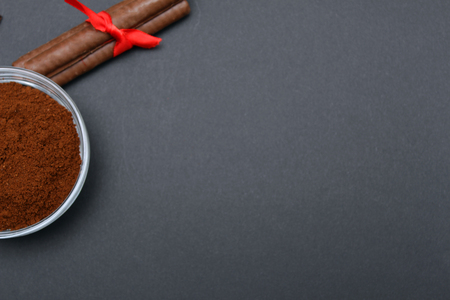 Ground coffee and chocolate on the  background and fresh piled coffee on wooden spoonの写真素材