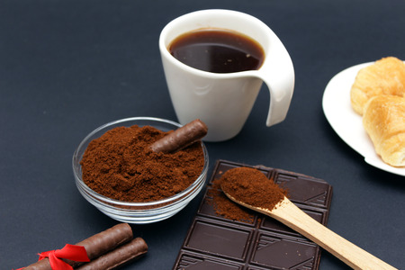breakfast with cup of black coffee, croissants and chocolateの写真素材