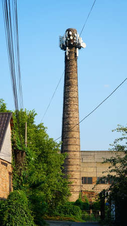 Telecommunication tower of 4G and 5G cellular. Base Station or Base Transceiver Station. Wireless Communication Antenna Transmitter. fragment of antenna construction over blue sky.の写真素材