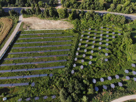 Solar panels lines in the field with big storm cloud in the sky. nの写真素材