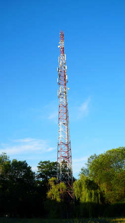 4G TV radio tower with parabolic antenna and satellite dish. Broadcast network signal. High coverage area. nの写真素材