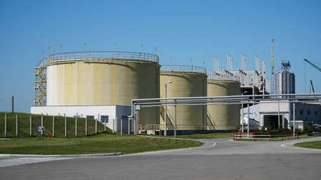 industrial oil press tank. Big industrial oil tanks in a refinery base. industrial plantの写真素材