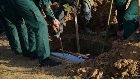 Funeral ceremony. People come to say goodbye. Burial in the grave. nの写真素材