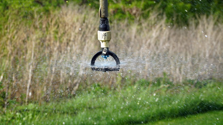 Close-up of an irrigation system for agriculture to stimulate plant growth during intense and intense heat. Concept: agriculture or water supply. nの写真素材
