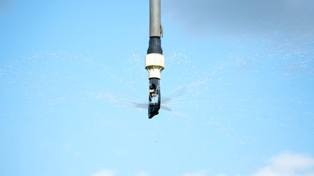 Close-up of an irrigation system for agriculture to stimulate plant growth during intense and intense heat. Concept: agriculture or water supply. nの写真素材