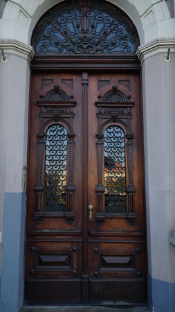 The rich decor decorates an entrance door of the old building of traditional architecture of in downtownの写真素材