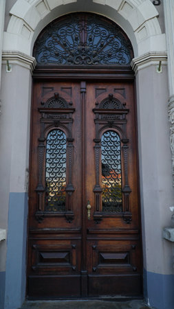 door. Big Double Arch Door. old wooden Front Door of a Traditional European Town House. Old entrance door in a small town.の写真素材