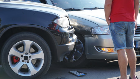 traffic accident. Wrecked car. Car crash accident on street, damaged automobiles after collision in city.の写真素材