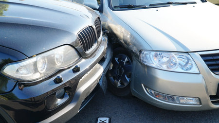traffic accident. Wrecked car. Car crashed into parked car on neighborhood street.の写真素材