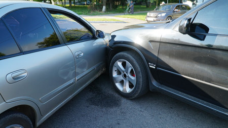 traffic accident. Wrecked car. Car crashed into parked car on neighborhood street.の写真素材