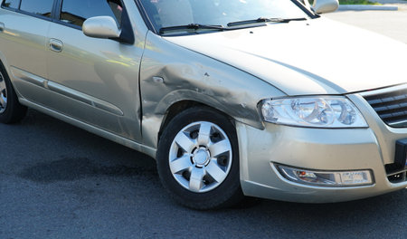 traffic accident. wrecked car. Car crashed into parked car on neighborhood street.の写真素材