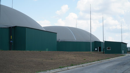 Biogas. Modern bio comlex. Renewable energy from biomass. Innovative biogas plant among green nature.の写真素材