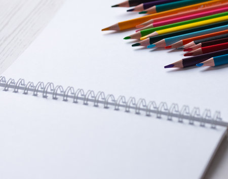 colored pencils on the open sketchbookの写真素材