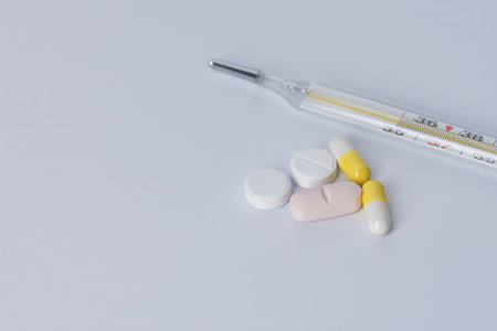 tablet on white background, medicine, thermometer.