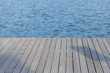 wooden planks on a background of water.の写真素材