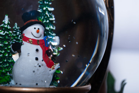 snowman in a glass ball with snow, New Year's decorative toyの写真素材