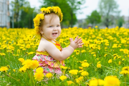 Happy little girl  on the meadowの写真素材
