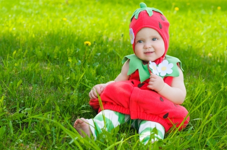 Happy little girl  on the meadowの写真素材