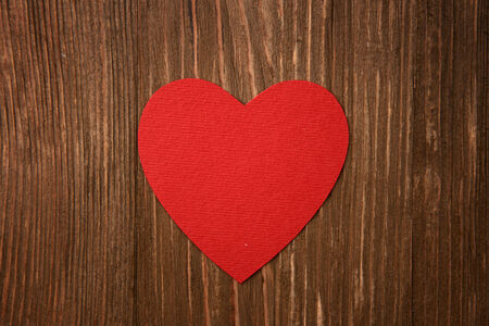 Love heart on wooden texture background, valentines day card conceptの写真素材