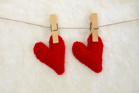 Love hearts on white fur background, valentines day card conceptの写真素材