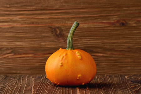 decorative pumpkins for halloween on wood backgroundの写真素材