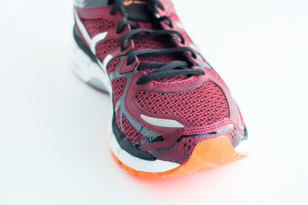 Red sports shoes on a white backgroundの写真素材