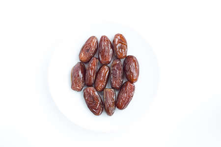 Figs on a plate on a white background. Dried fruitsの写真素材