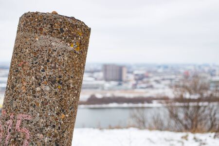 Concrete pillar on the background of the city dayの写真素材