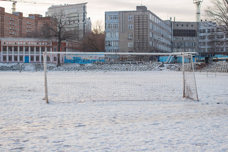 Soccer goal in the winter in the city in the daytimeの写真素材