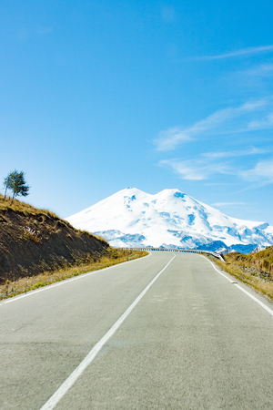Road to the mountain Elbrus in the daytimeの写真素材
