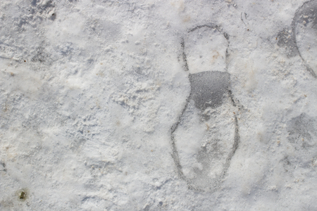 Footprints in the snow ice winter dayの写真素材