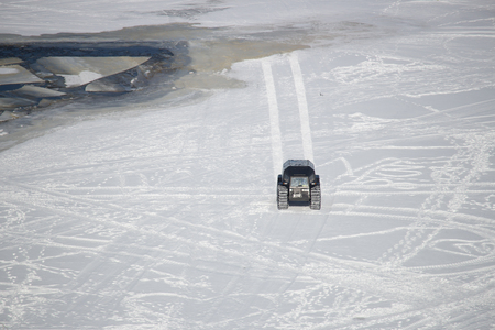 On snowy desert surface race on all-terrain suv top view copy spaceの写真素材