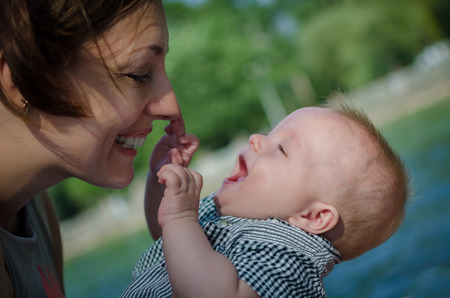 Beautiful smiling mother and cute baby funの写真素材