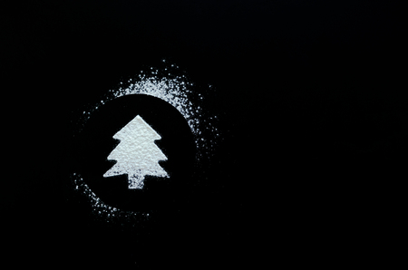 Christmas tree symbol on blackboard with place for text. fir tree drawing on a school chalkboard. Copy space.の写真素材