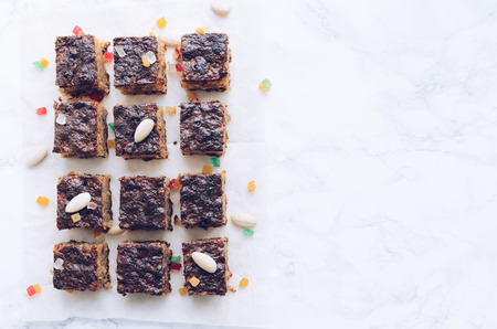 Torta di riso. Baked rice pudding dessert sweetened with sugar powder and garnished with candied orange peels in the top. Rice cake with almonds and amaretto. Top view. Copy space.の写真素材