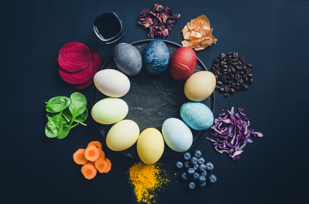 Easter eggs painted with natural egg dye from fruits and vegetables. Homemade naturally dyed Easter eggs with ingredients.の写真素材