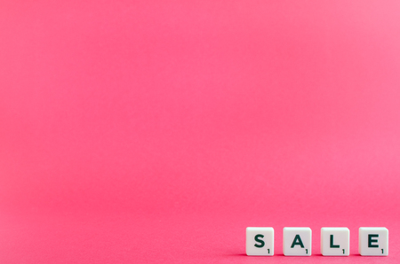 Word SALE on pink background. Online shopping concept Black Friday and Ciber Monday. Copy space.の写真素材