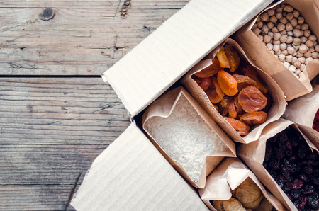 Zero waste delivery concept. Eco-friendly packing. Paper bags with organic food, zero waste shopping, sustainable living, plasticfree. Top view.の写真素材