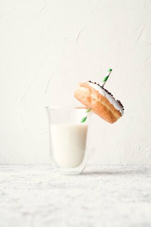 Donut with glass of milk on white background. Copy space.の写真素材