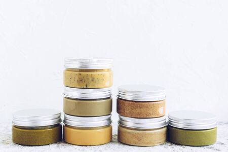 Nuts and seeds butter in glass jars.の写真素材