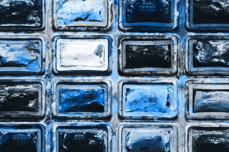 Closeup background texture of messy, used classic blue tones watercolor paintbox. Creative...