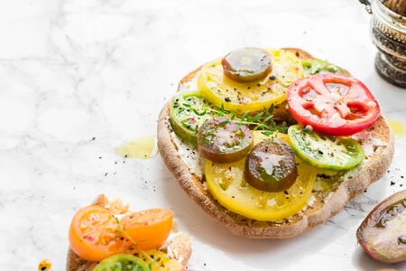 Italian appetizer Friselle with tomatoes, cheese and thyme.