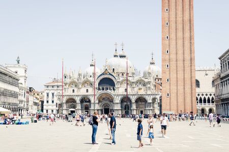 Venice, Italy - Sightseeing place of famous travel destination. Tourists in Piazza San Marco in front of the basilica.の写真素材