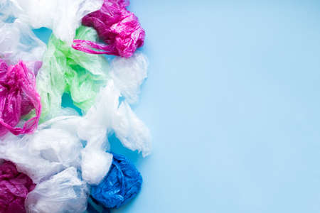 Many disposable plastic bags texture background. Zero waste shopping. Sustainable living, plastic free concept. Eco friendly plastic free items. Top view. Copy space.の写真素材