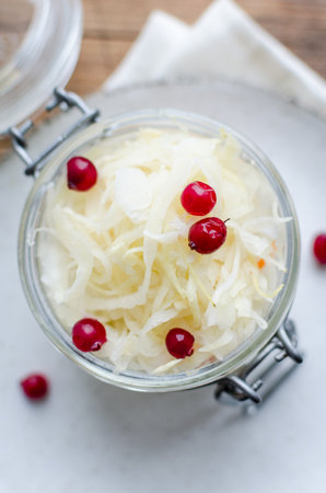 Homemade sauerkraut village fermented cabbage. Vegan salad rustic style glass jar. Fermented food great for good health. Traditional rustic winter food.の写真素材