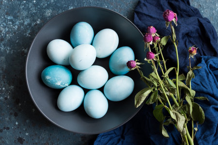 Blue Easter eggs with pink flowersの写真素材