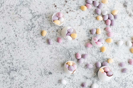 Easter composition with mini chocolate eggs in pastel colors