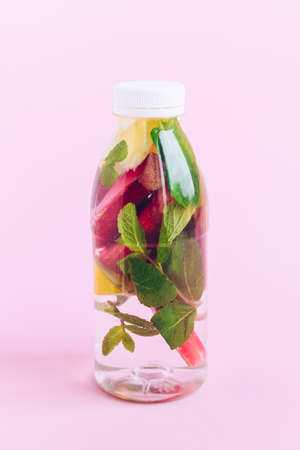 Bottle of detox water with rhubarb, mint and lemon